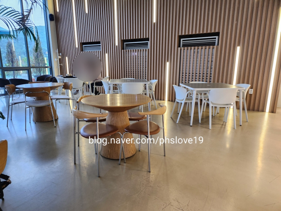 Cafe Interior Table Arrangement - Comfortable seating and indoor space with natural light