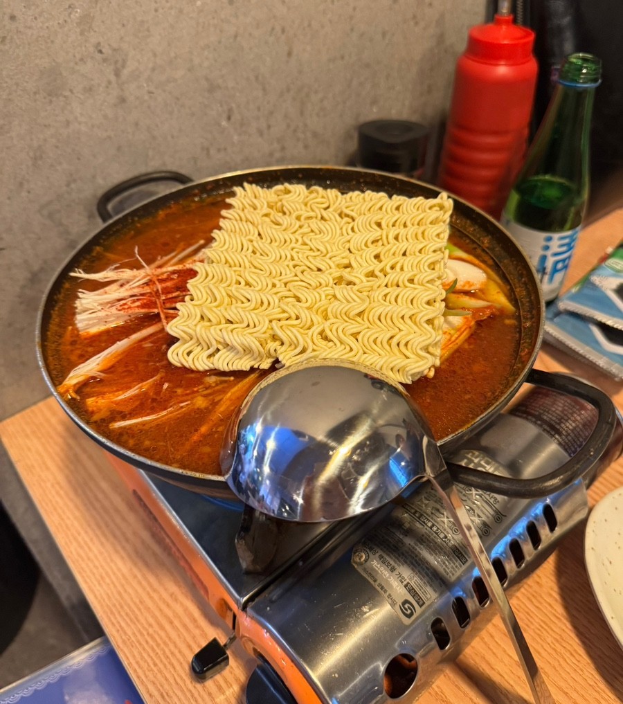 Spicy Fish Stew - A hot stew with red broth, amberjack head, and vegetables